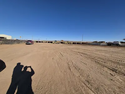 Construction site with construction vehicles in the background