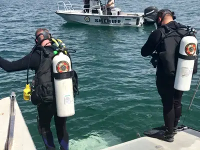 Divers at the end of a boat