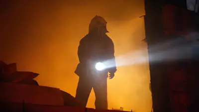 Fireman Holding Flashlight