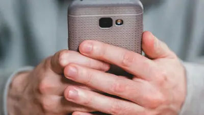 Person holding cell phone