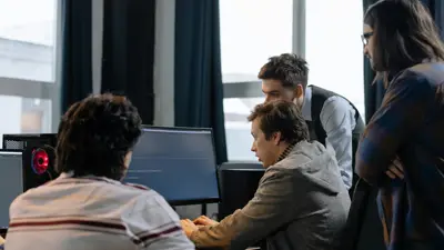 Group of people looking at computer screen